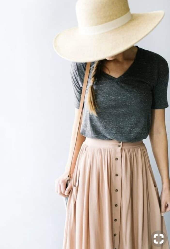 May's thrifted outfits, pink skirt, cream hat, grey shirt and tan bag.