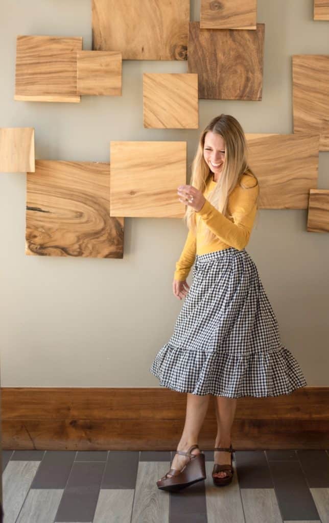 September outfits, september outfit inspiration, mustard yellow long sleeve top, gingham black and white skirt, brown pumps, brown wedges, fall outfits, modest church outfits