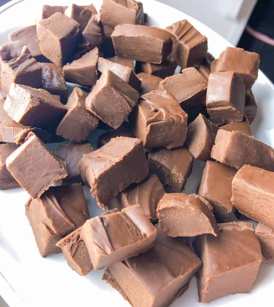 Three ingredient fudge is an easy recipe perfect for beginner bakers. This fudge is also the perfect holiday recipe. When making your christmas treats definitely add this to you list of neighbor gift ideas. 