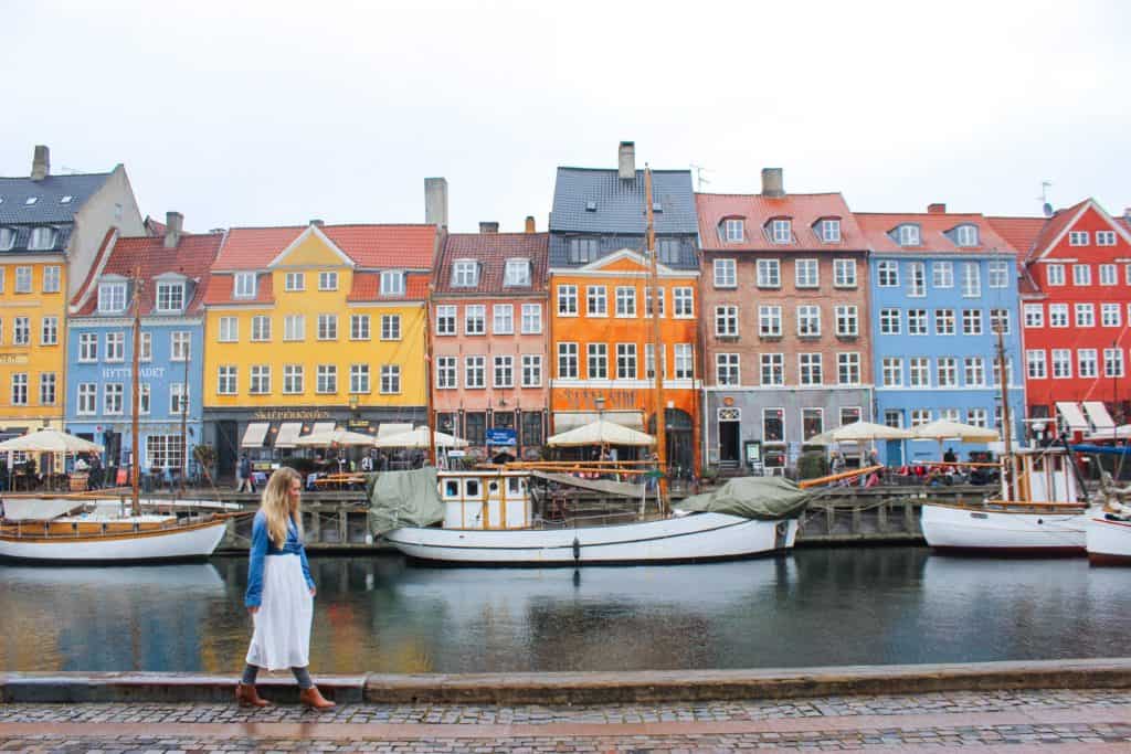 The popular tourist stop in Copenhagen: Nyhavn. This canal is lined by shops and restaurants. The colorful buildings are one of the must see stops in Copenhagen, Denmark even if you have only one day.