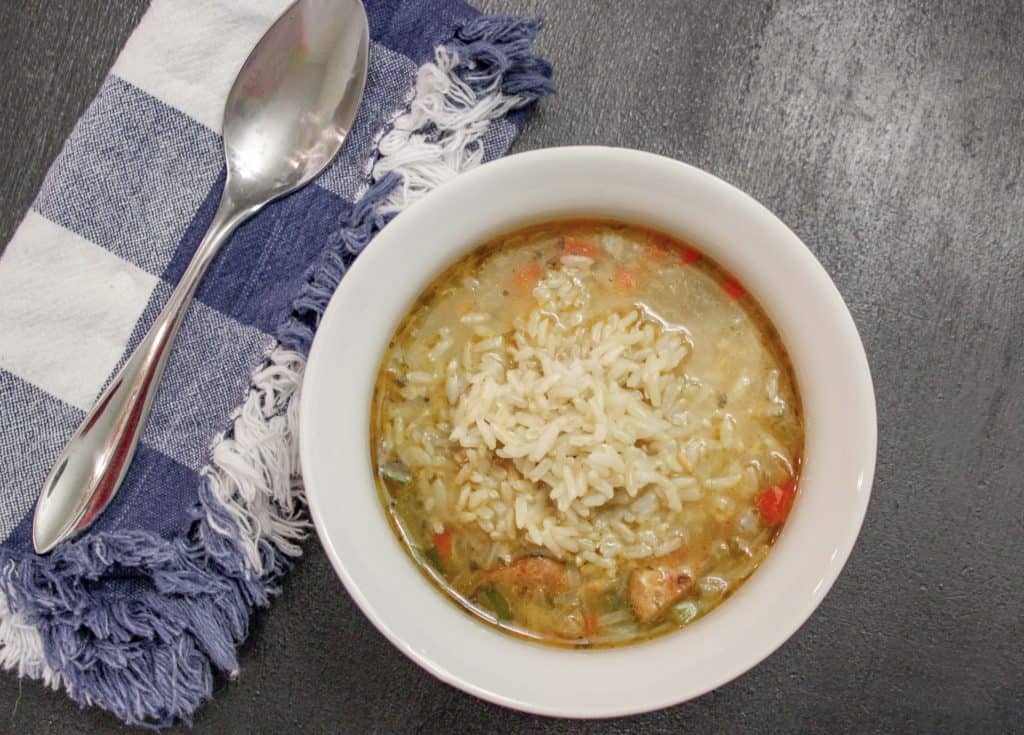 Authentic new orleans style gumbo recipe, this family recipe is hearty and a perfect fall recipe to add to your collection. It is a fairly easy gumbo recipe although it is not a fast recipe by any means. We typically make a chicken and sausage gumbo although it is very easy to turn it into a seafood gumbo by adding shrimp making it a shrimp gumbo.  It is the best gumbo recipe ever. Our homemade gumbo beat out all the gumbos we tried in New Orleans. This cajun gumbo will serve a large crowd  although you may not want to share. This is definitely a southern food , specifically from Louisiana style cooking. Enjoy!