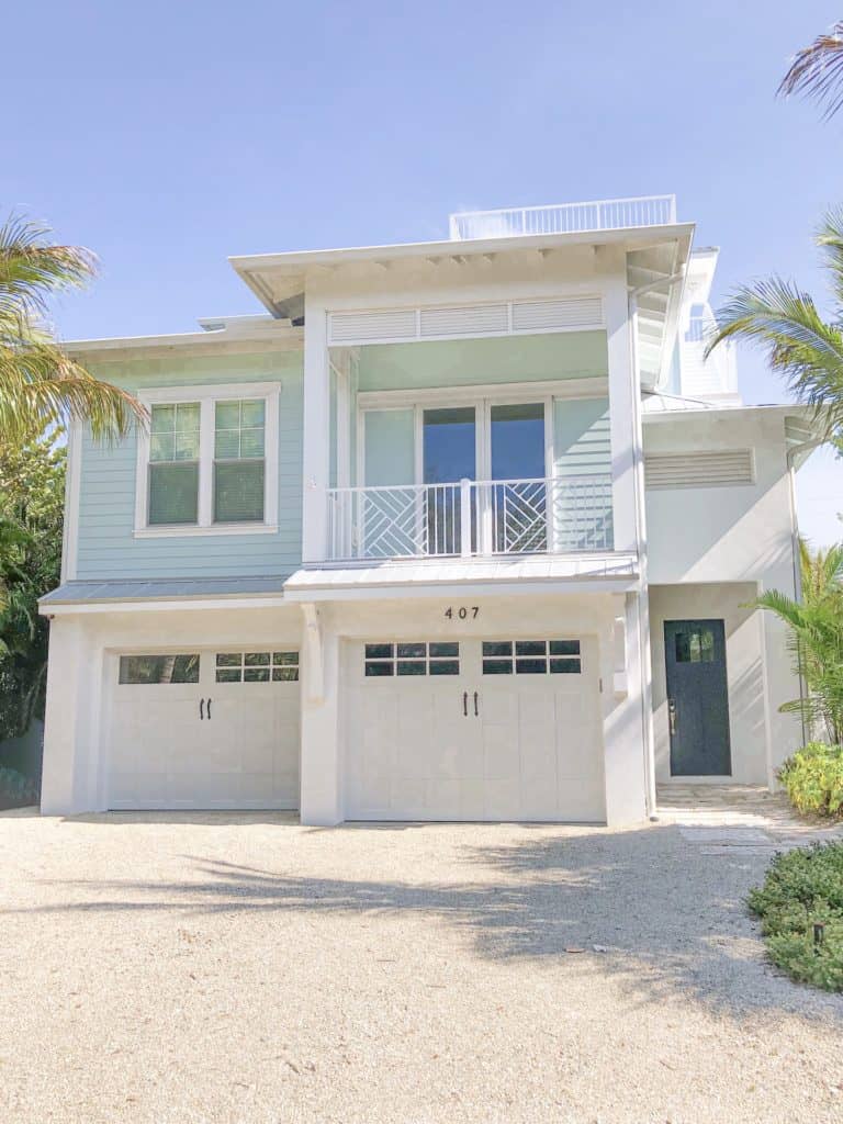 A pretty blue beach house on Anna Maria Island. It is fun to look at all the beach houses during a day trip to Anna Maria Island and it would be really fun to rent a beach house for the whole family for a vacation on Anna Maria Island.