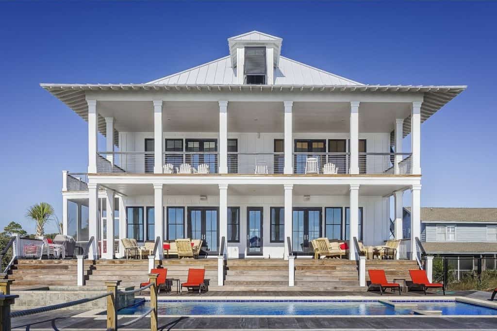 A beautiful large white housewife a pool and a wrap around porch. Of all the things to save up for a house is a great one. They also take a lot of upkeep and repairs so emergency savings and other savings accounts are important.
