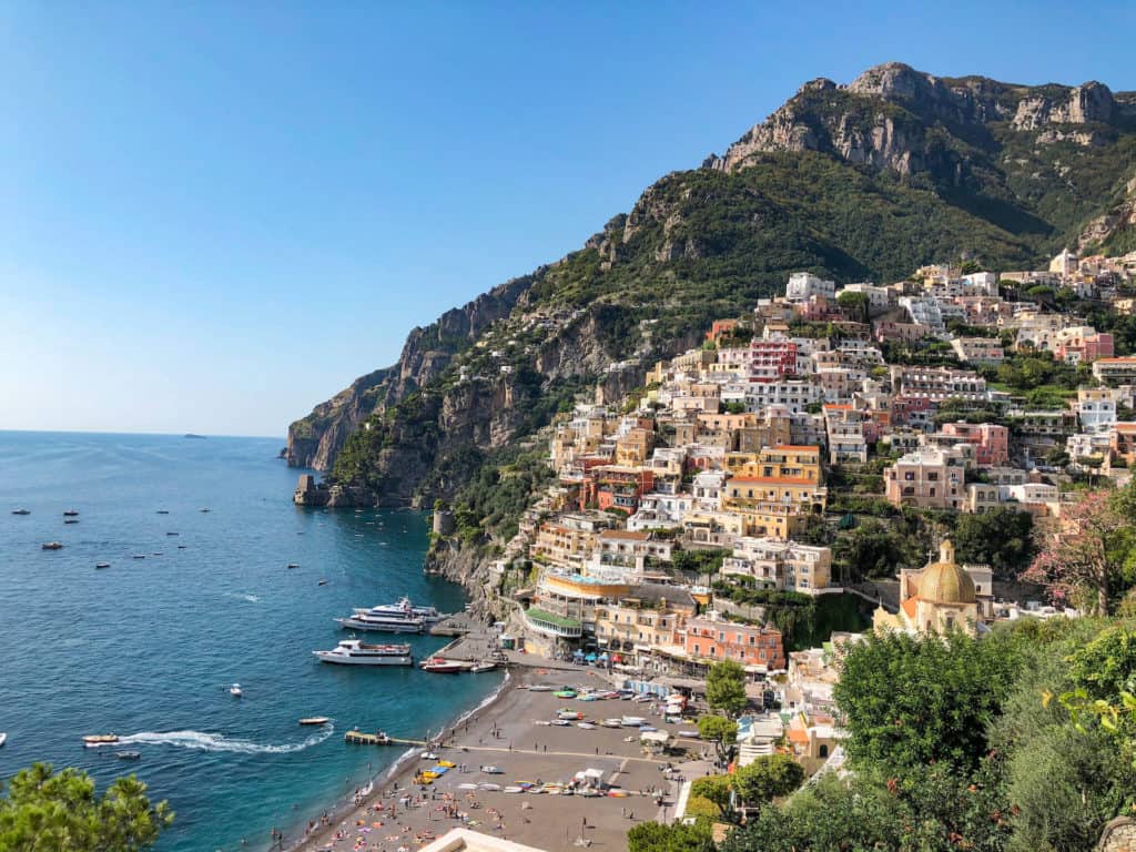 The town of Positano sprawled up the mountainside. The Pastel buildings make a nice contrast to the mountain and ocean blues and greens. 