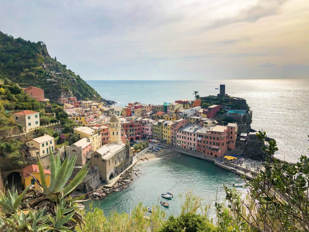 the town of Vernazza in Cinque Terre Italy. This italian town with the colorful buildings is very beautiful and the best viewpoint of vernazza is from the hiking trail. Amalfi Coast and Cinque Terre are amazing destinations.