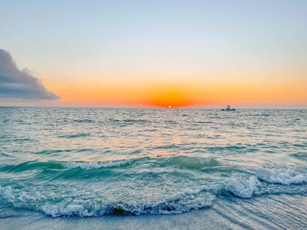 A beautiful sunset on St. Pete Beach one of Tampa Bays beautiful beaches. The beach is the perfect day trip from Tampa that you can do any time of year.