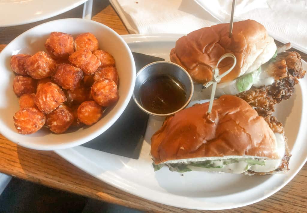 Craft Street Kitchen is one of the best Tampa Bay Restaurants with so many good dishes to try. My favorite is pictured here: the Chicken Cordon Who sandwich with sweet potato tots.