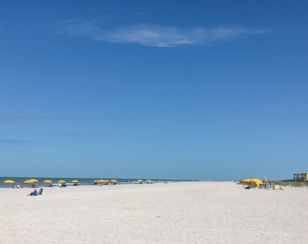 The vast shoreline of Treasure Island. Tampa beaches are sunny and beautiful with white sand shores and emerald green water. This guide to the beaches in and around Tampa will help you choose the right beach for you and your family on your next beach vacation.