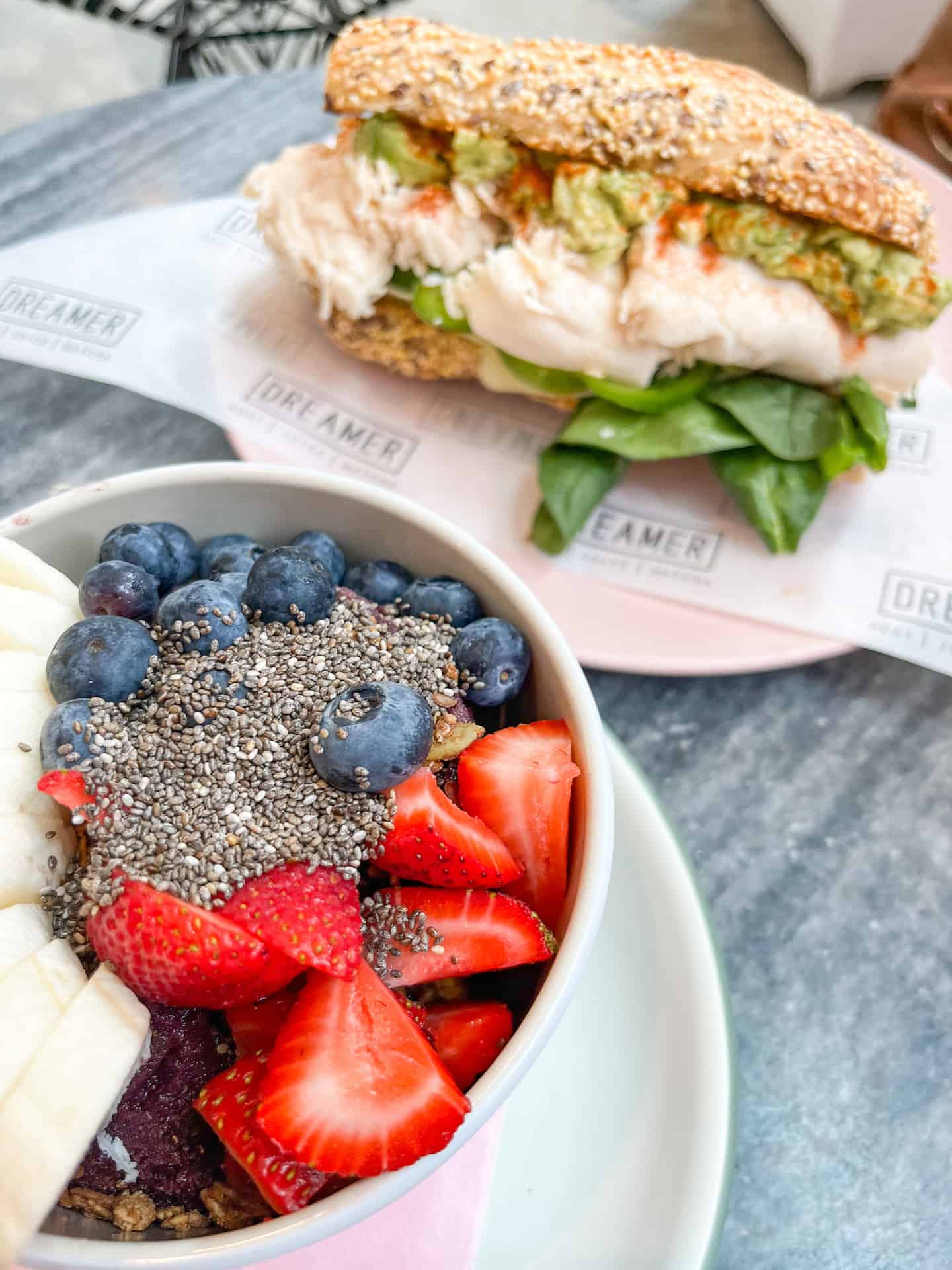The Acai bowl and spicy turkey sandwich from Dreamers Cafe in Miami, a great place to stop and eat in between sights during your 3 day Miami itinerary.