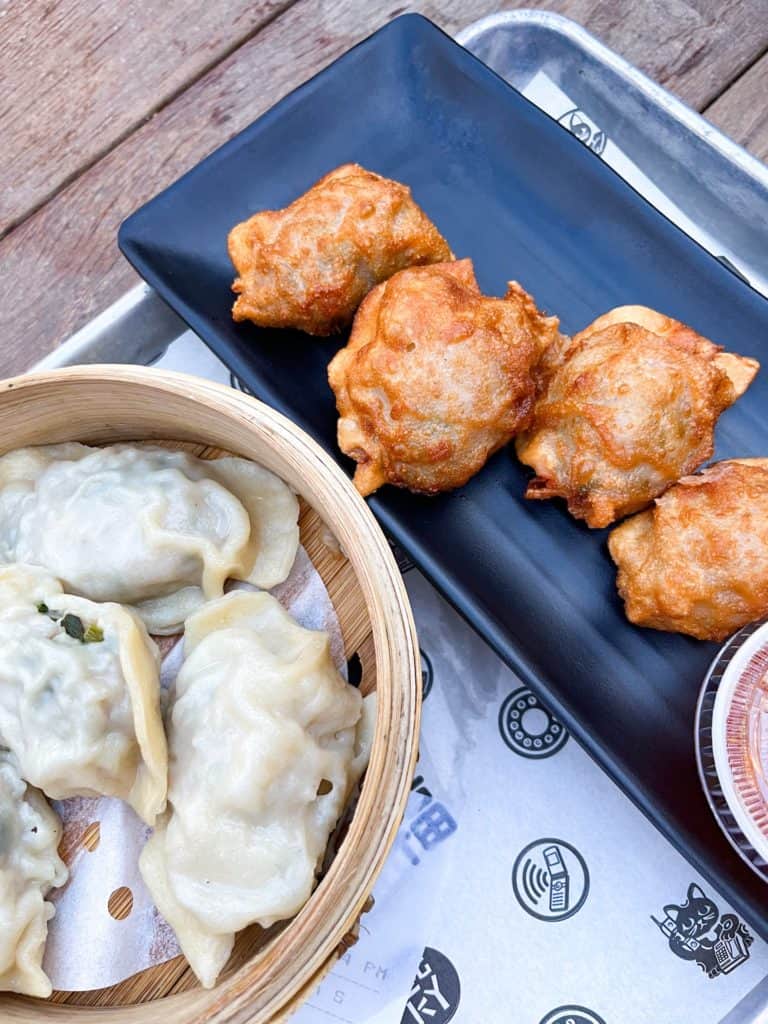 Steamed and fried wontons from 1-800-lucky an asian food hall in Wynwood, Miami. It has many options making it one of the best restaurants in Miami.