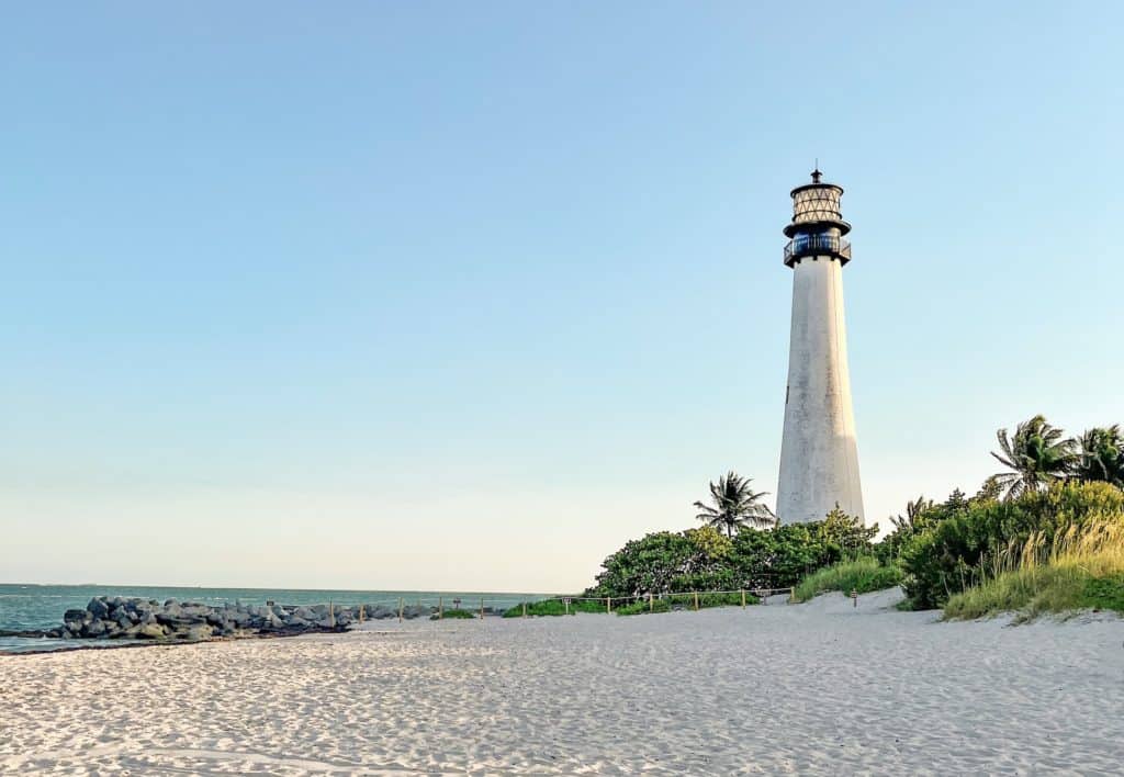 Cape Florida Lighthouse sites on a beautiful tan sand beach just south of Miami.