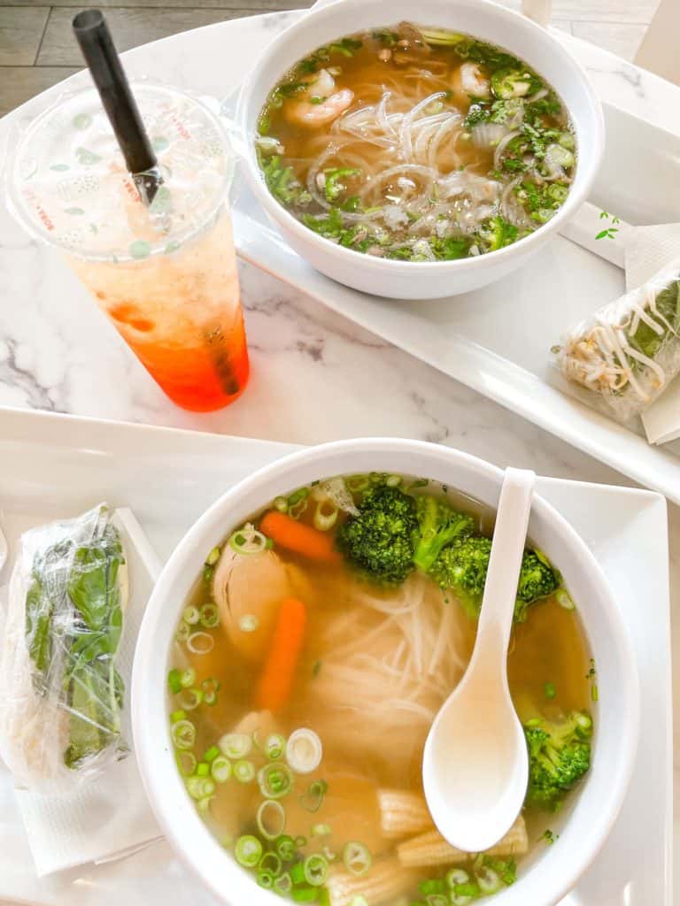 Two bowls of pho and a large boba from Nine Five Pho, one of the best restaurants in Miami.