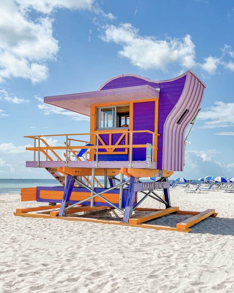 A colorful purple and orange lifeguard stand on South Beach in Miami.
