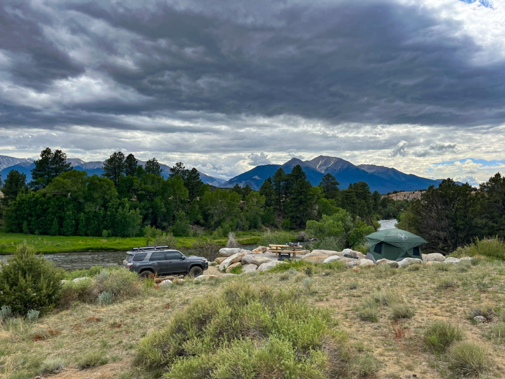 A stunning campsite in the Colorado mountains. Right by the Arkansas River, one of the best things to do in Buena Vista is go camping.