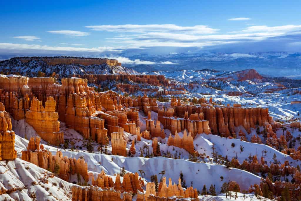 Bryce canyon is one of the best winter vacations in the US for families because the hiking is fun and the red rock contrasting the white snow is absolutely beautiful.