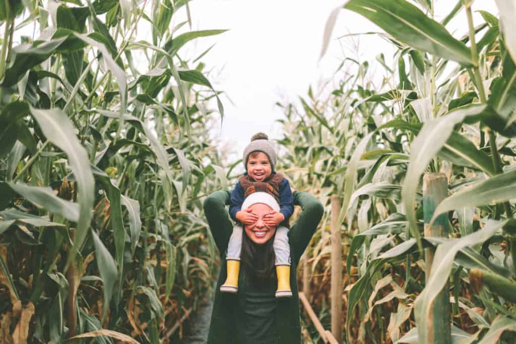 Mom and son playing in a corn field in Tampa