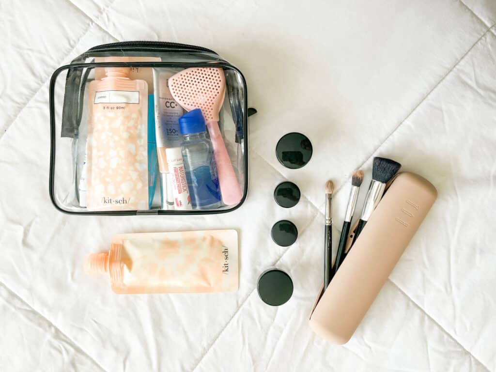 Some of my favorite travel containers when figuring out how to pack makeup for travel by plane are liquid bottles, small containers, a brush bag and a clear plastic bag for liquids.