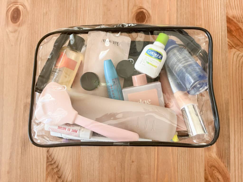 A large toiletry bag like this one is perfect for packing makeup and toiletries in checked luggage.