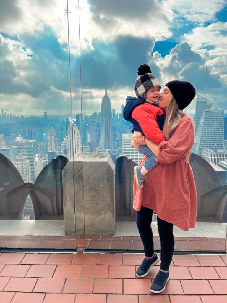 Mom and two year old son enjoying the view of the empire state building. Traveling with two year olds can be difficult but the memories are worth it.