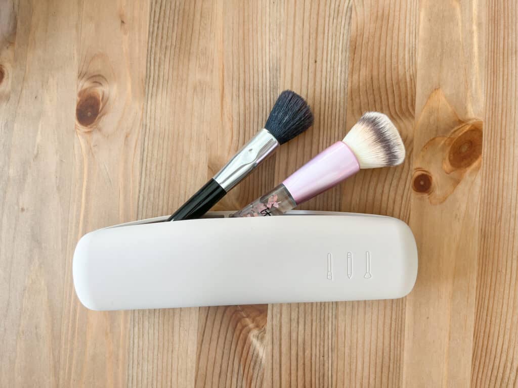 The silicone makeup brush holder with makeup brushes inside.