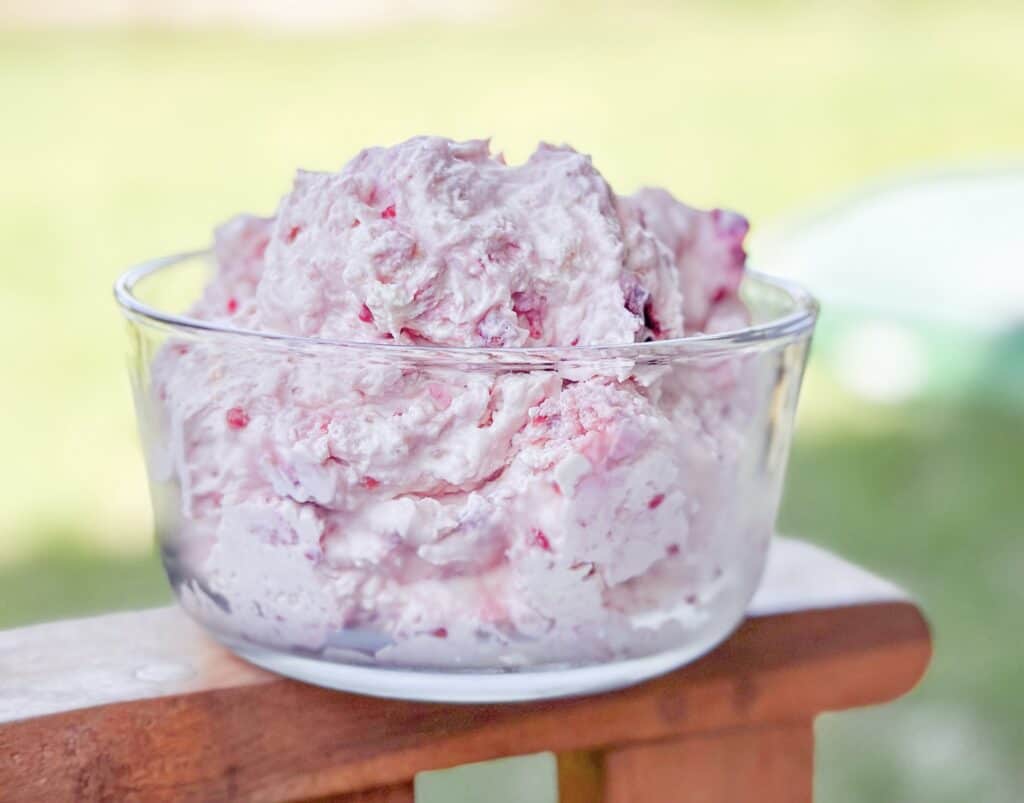 A big bowl of pink fluff dessert.