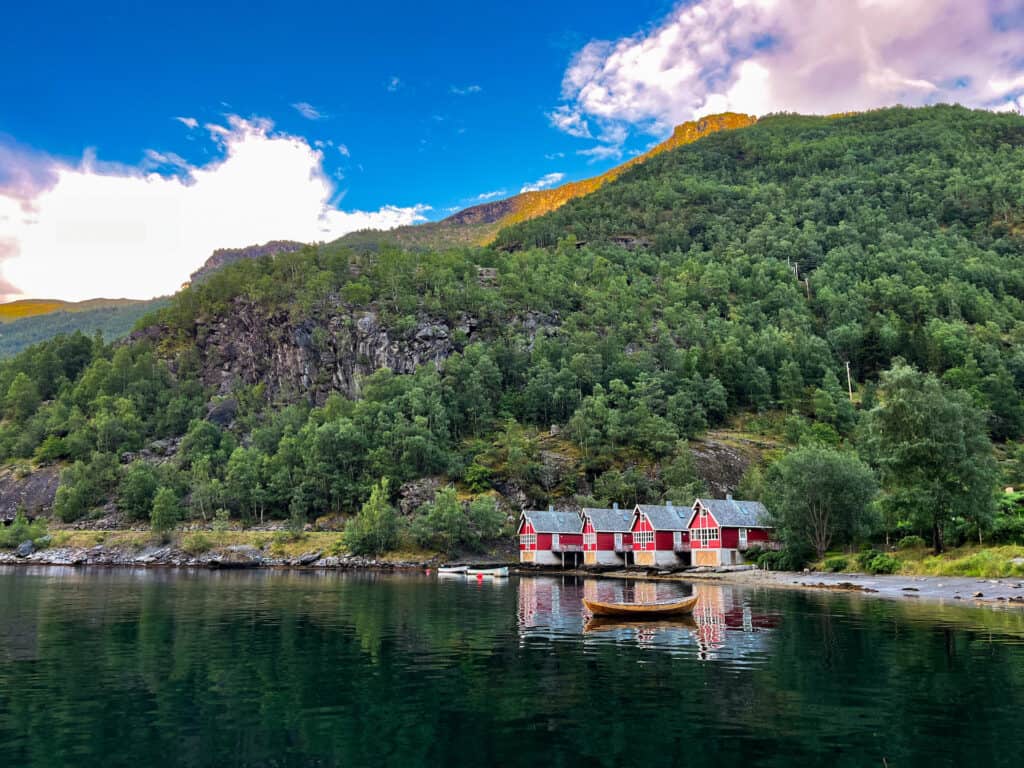The Flåm marina restaurant offers the best views of the fjords in all of flam. this small red cabins are right next door.
