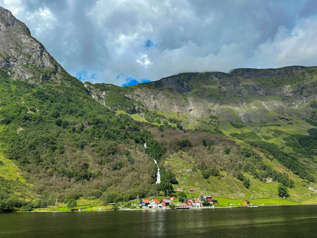 There are small towns in the fjords like this one that are accessible only by boat! See it all during your DIY Norway in a Nutshell tour.