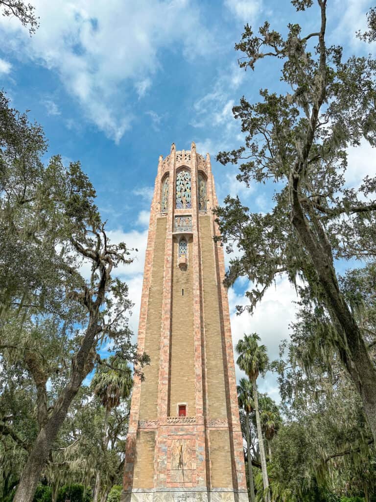 The singing tower is a carillon bell instrument that can be listened to from the grounds of Bok Tower Gardens.
