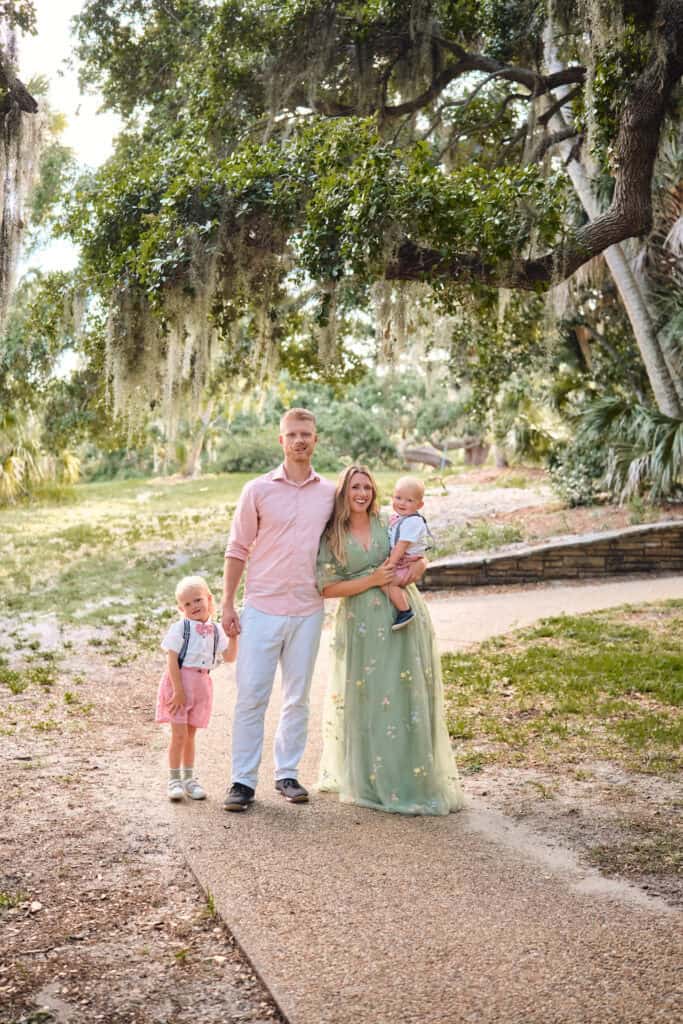 Family standing on a winding stone path inside Philippe Park.